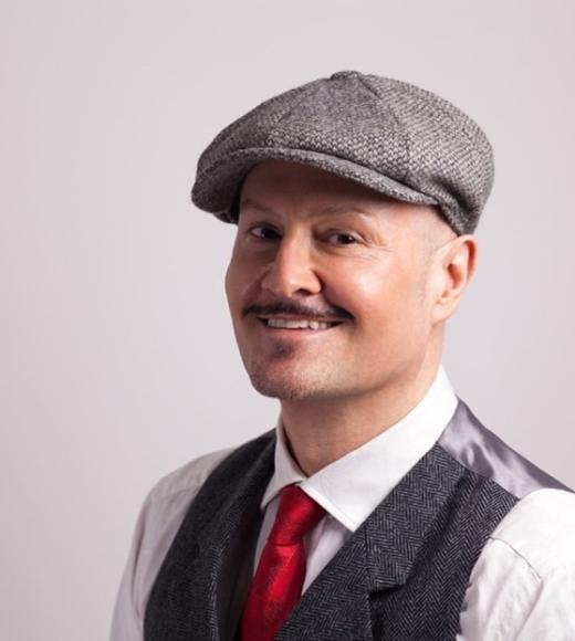 Headshot of Paul Burston smiling